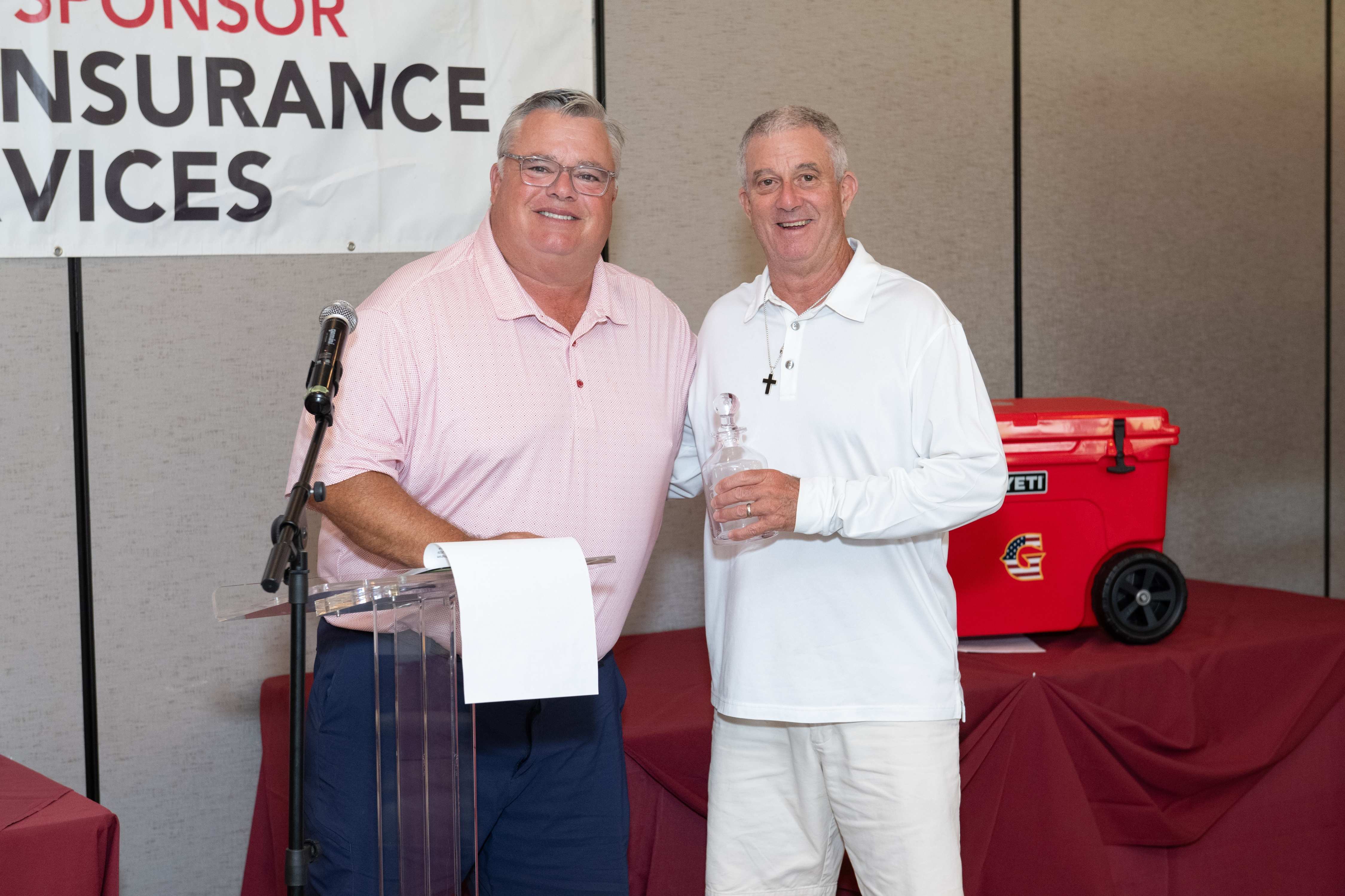 Rick Dinger presents the Hole 5 Closest to the Pin Award to Mark Trueblood at 4 feet and 4 inches. 