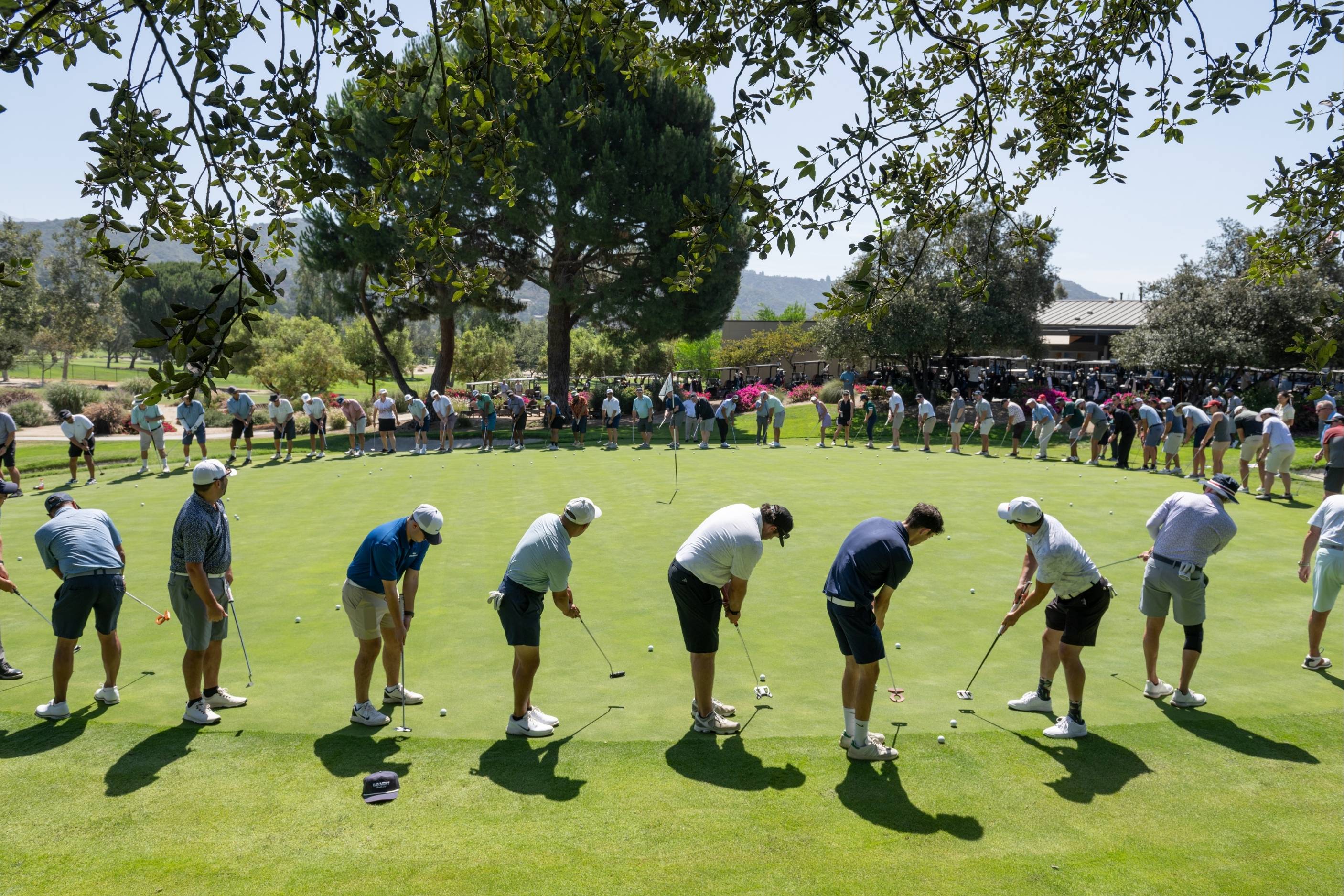 Golfers competing in the tee putting contest.