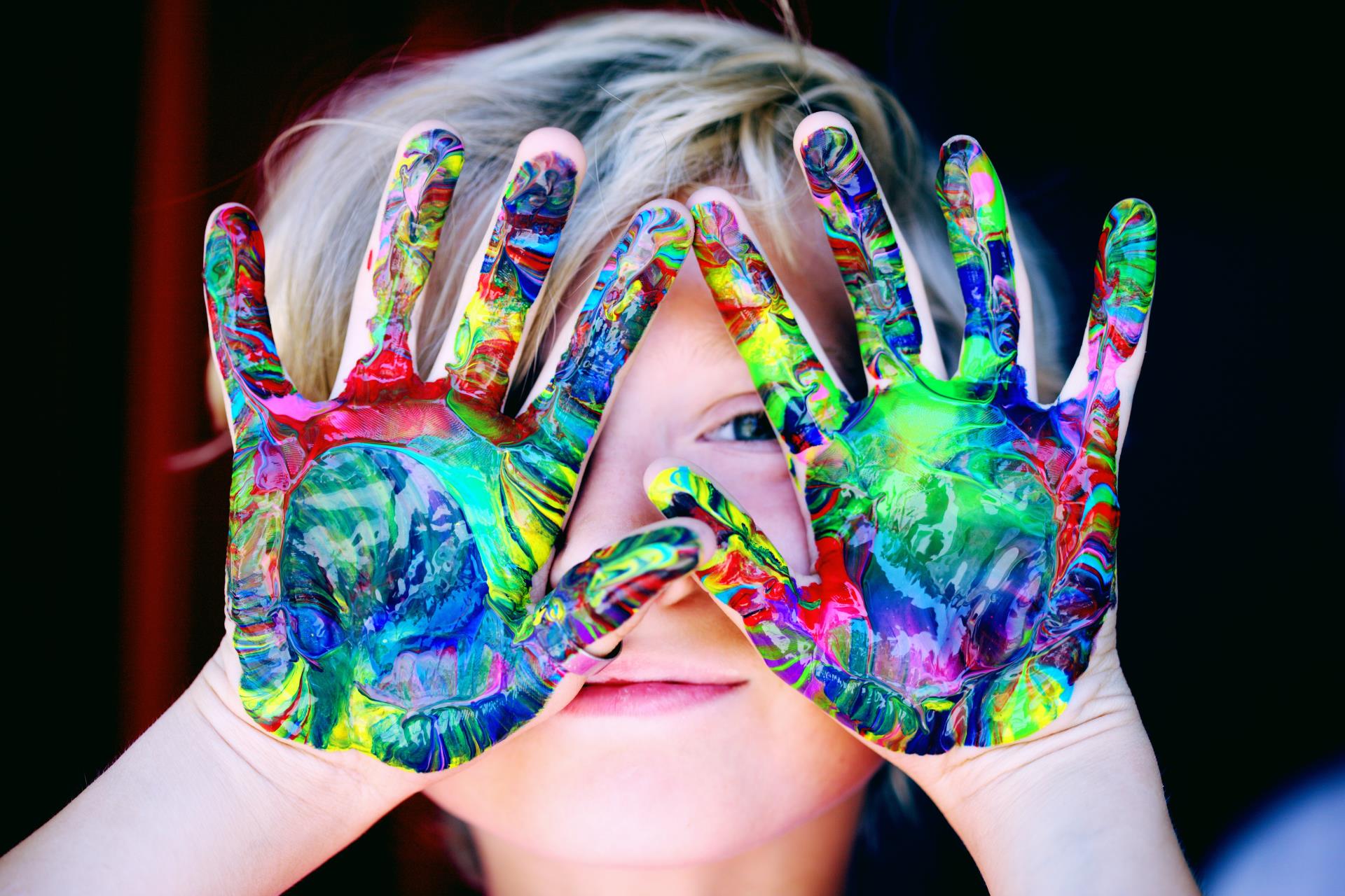 child with painted hands