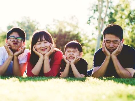 happy fam on grass