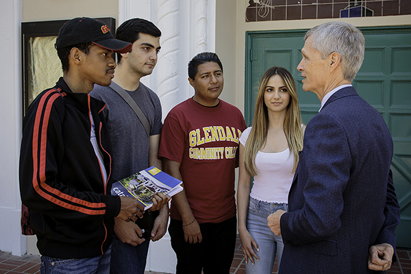 Dr. Viar speaking with students