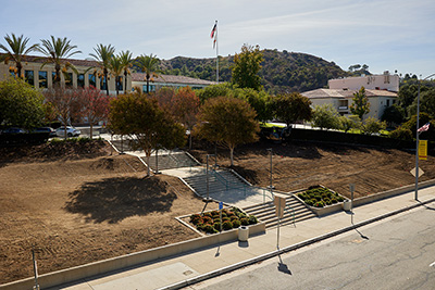 The stairs and lawn at the front entrance to the Verdugo Campus are coming back together