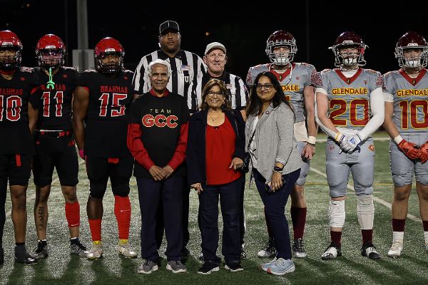 The football game began with a coin toss from Bhupesh Parikh